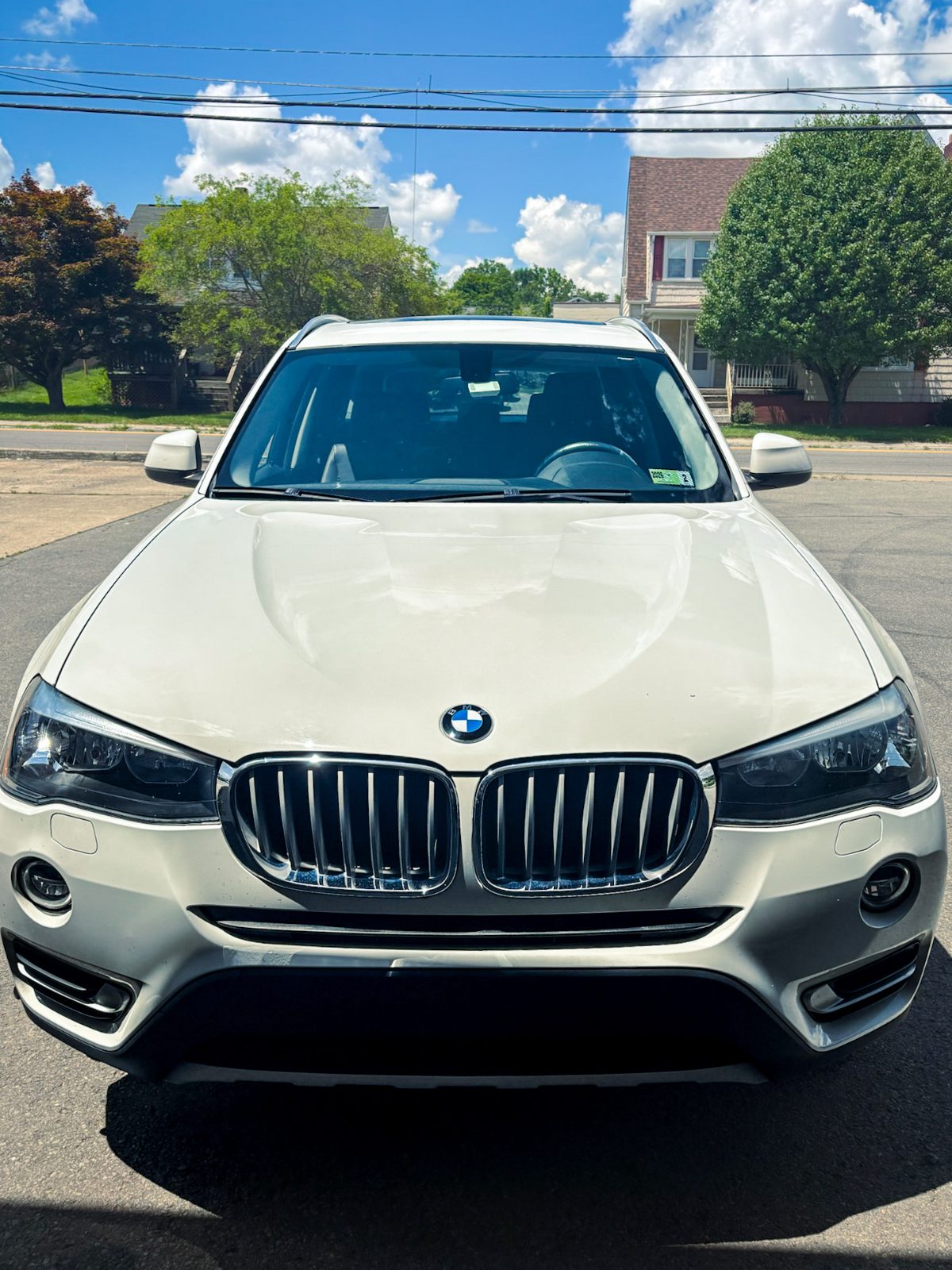 White BMW X3 front end after exterior detail
