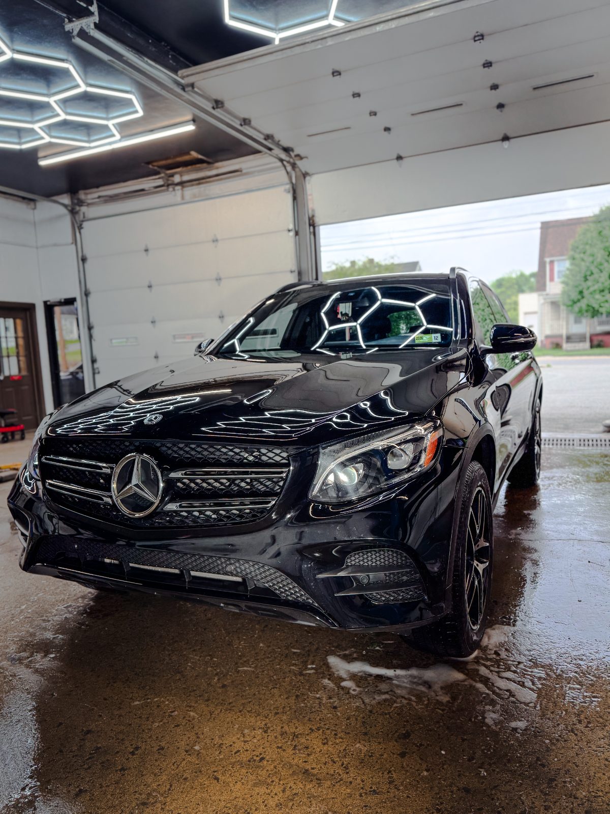 Black Mercedes-Benz GLC ceramic coated under hex lighting